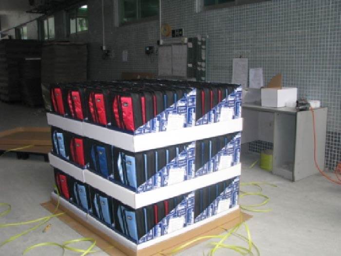 Benefits of Temporary Displays A store employee easily assembling a cardboard POP display